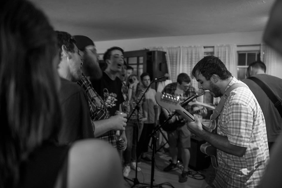 Great White Tourist performing at the Goffstown, NH house with crowd singing in their face